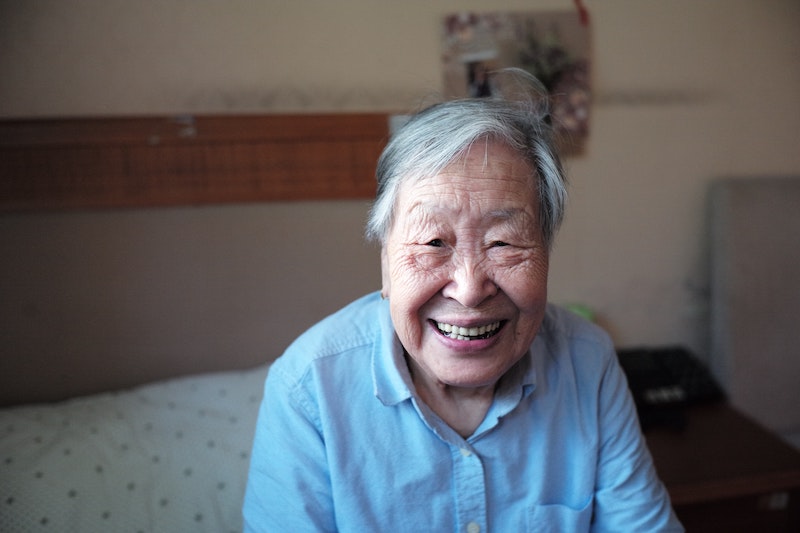 Older lady on bed smiling